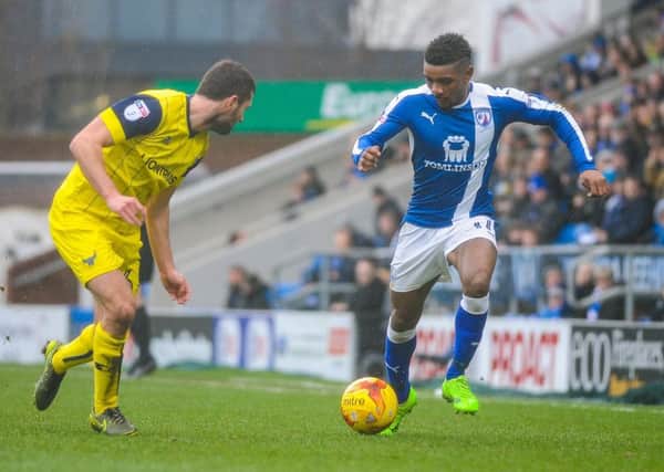 Chesterfield's midfielder Reece Mitchell (11) is faced up by Oxford Utd's defender Phil Edwards (16).

Picture by Stephen Buckley/AHPIX.com. Football, League 1, Chesterfield v Oxford United; 25/02/2017 KO 3.00pm 
Proact stadium; copyright picture; Howard Roe; 07973 739229