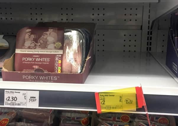 A empty shelf of sold out Porky Lights sausages