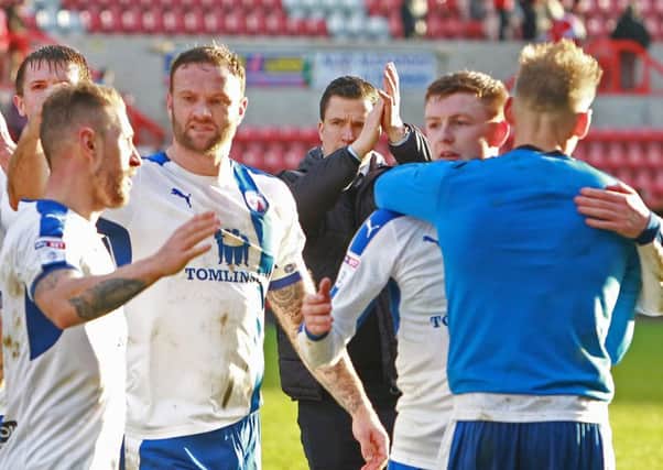 Howard Roe/AHPIX.com. 
Gary Caldwell applauds the travelling fans as his players celebrate victory at Swindon