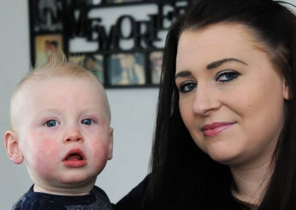 Sophie Barker with her one year old son Ollie at their Lings Crescent home in North Wingfield.