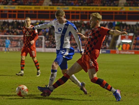 Chesterfield's Dion Donohue battles with Walsall's Jason McCarthy