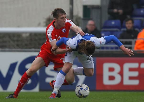 Tom Anderson wrestles for the ball