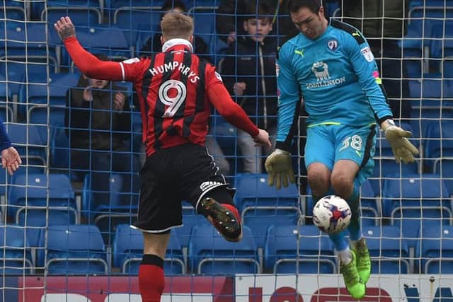 Chesterfield's keeper Thorsten Stuckmann saves a certain goal from Shrewsbury's Stephen Humphrys