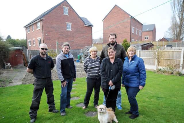 Residents on Churston Road, with the development behind their back gardens, they are from left, Jim Love, Colin Bates, Marcia Bates, Lesley Pearson, Matt Griffiths and Janet Pearson.