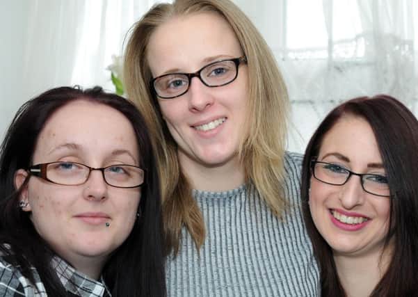 Sisters, from left, Leann, Sara and Adrienne Lakin who along with their mother and another sister, all suffer from fibromyalgia.