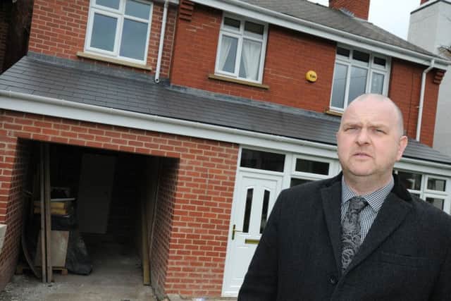 Phil Taylor outside his house on Newbold Road, and the extention which has been compromised by a bad batch of concrete.