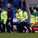 Chesterfield's Ian Evatt is stretchered off the pitch