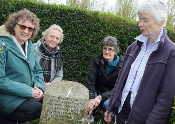 Friends of Spital Cemetery from left, Lyn Pardo Roques, Liz Cook, Margaret Hersee and Janet Murphy,  at the leper priest grave.