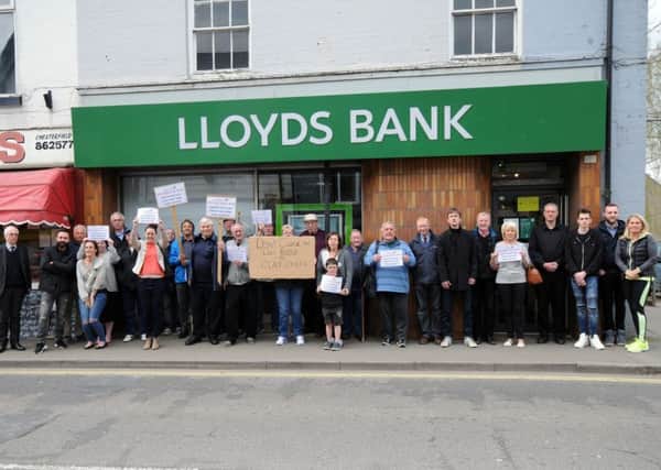 Locals gather to show their disapproval of Lloyds Bank's decision to close it's Clay Cross branch on High Street.