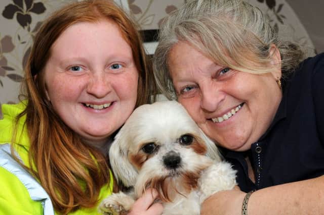 Lesley Wheatcroft and her daughter Rebecca Lucas, 17, are reunited with Rebecca's Shih Tzu dog, Honey.