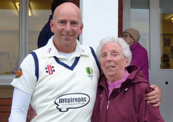 Brian Gladwin celebrates the achievement with his biggest fan, his mum, who prepared the teas for the game.