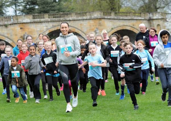 Jessica Ennis-Hill promotes the event with local schoolchildren at Chatsworth House.
