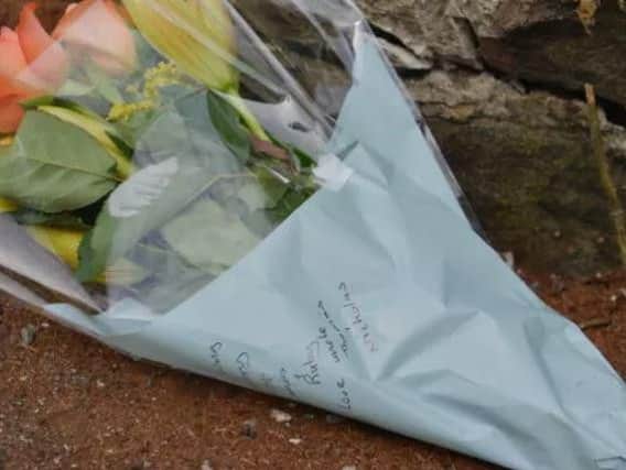 Flowers have been left at the scene of the tragedy.