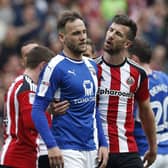 Jake Wright of Sheffield Utd  walks Dan Gardner of Chesterfield after his sending off during the English League One match at  Bramall Lane Stadium, Sheffield. Picture date: April 30th 2017. Pic credit should read: Simon Bellis/Sportimage