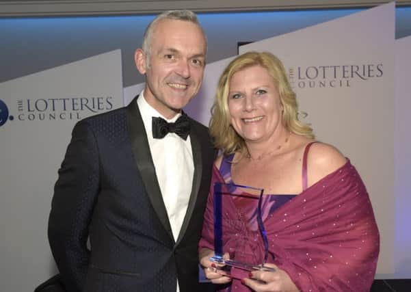Treetops lottery manager Mel de Vos receives the award. Picture Paul Thomas