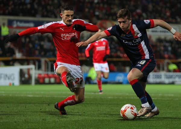 Picture by Gareth Williams/AHPIX.com. Football, Sky Bet League One; 
Swindon Town v Doncaster Rovers; 01/03/2016 KO 7.45;  
County Ground;Copyright picture;Howard Roe/AHPIX.com
Rovers' Lynden Gooch takes on Swindon's Bradley Barry