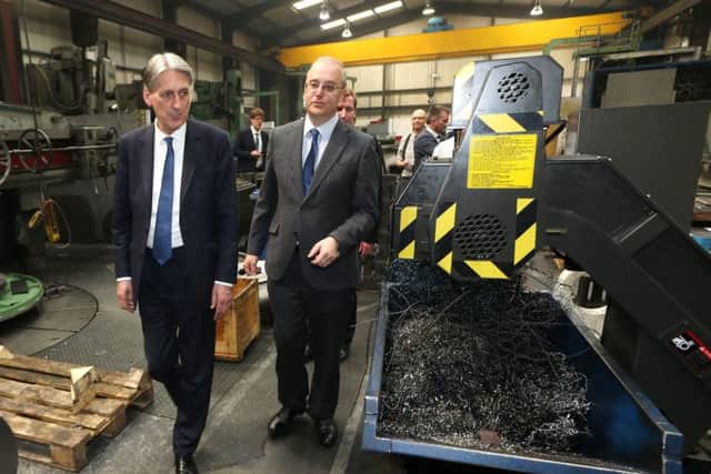 IN PICTURE: Chancellor Philip Hammond is given the guided tour of Millbrook Precision Engineering in Clay Cross with the Conservative candidate Lee Rowley and Nigel Sterland - managing director of Millbrook Precision Engineering.