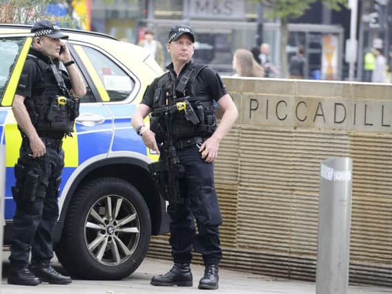 Armed police on the streets of Manchester after Monday night's terror attack. Photo - SWNS