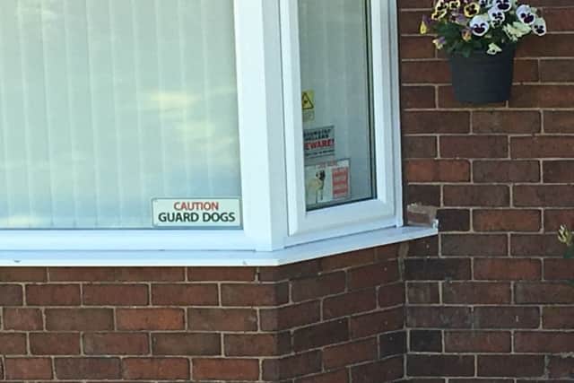 A sign in the window of the property.