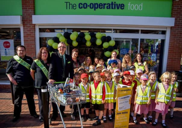 Pupils from Horsley Woodhouse Primary School help open the new Central England Co-operative Food Store in Horsley Woodhouse.