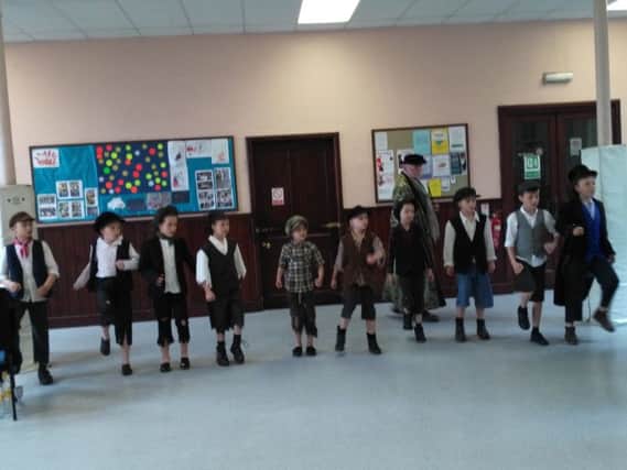 Children rehearsing for Oliver!, presented by Matlock Musical Theatre.