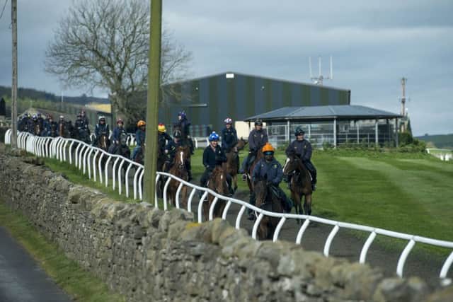 Jockeys riding out at Mark Johnston's yard in Middleham, Yorkshire, which hopes to be celebrating its first Investec Derby winner on Saturday, courtesy of Permian.