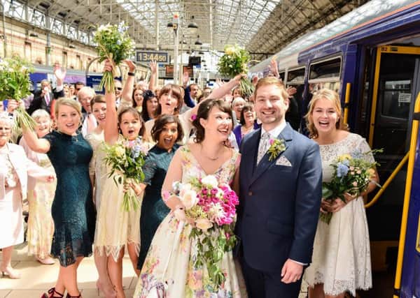 Briony Robinson and Sam Bacon with the wedding party at Manchester Piccadilly.