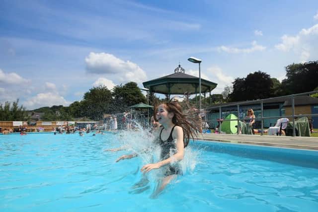 Rosie Endacott, 13 and Naomi McDonough 13, cooling down at Hathersage Lido earlier this week. Photo - SWNS