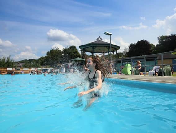 Rosie Endacott, 13 and Naomi McDonough 13, cooling down at Hathersage Lido earlier this week. Photo - SWNS