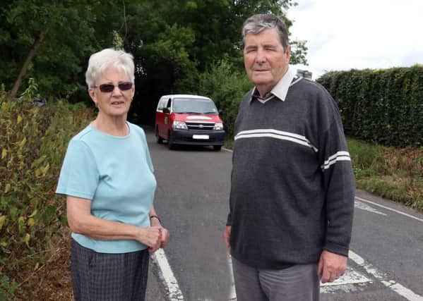 Brenda Draycott and Tony Rogers stand on Crow Lane / Wetlands Lane.