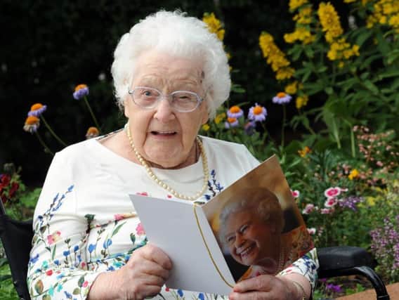 Mrs Potter with her birthday card from the Queen. Picture: Anne Shelley.