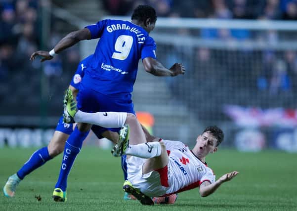 MK Dons vs Chesterfield - Armand Gnanduillet tussels with Mk Don's Mark Randall - Pic By James Williamson