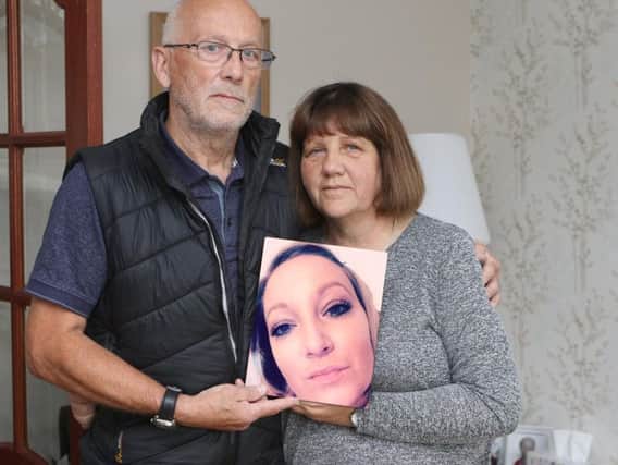 Paul and Annette Pattison with a picture of their late daughter, Stacy. Picture: Jason Chadwick.