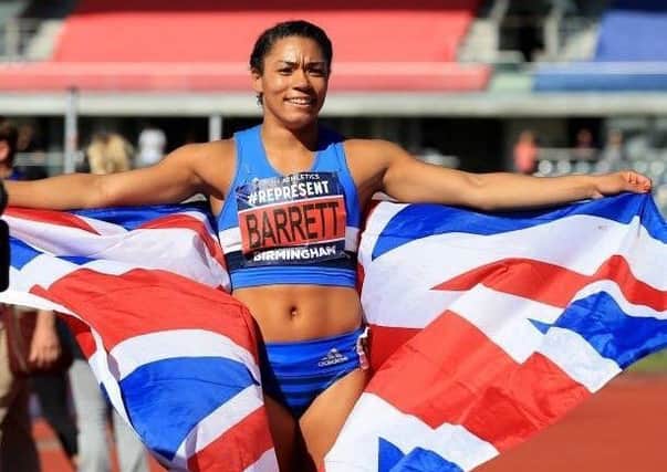 Alicia Barrett celebrates after becoming the new British 100m hurdles champion.