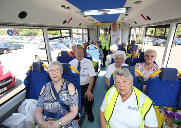 Jon Broad, driver for Clowne and District Community Transport, picture middle left with a bus full of service users. Picture by Mark Fear.