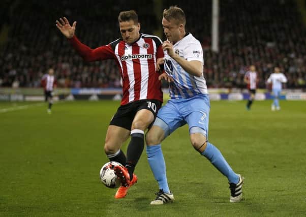 Billy Sharp of Sheffield Utd in action with Nathan Clarke of Coventry City during the English League One match at Bramall Lane Stadium, Sheffield. Picture date: April 5th 2017. Pic credit should read: Simon Bellis/Sportimage