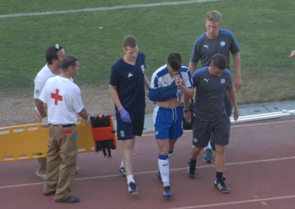 Joe Rowley helped from the pitch after injurying his shoulder against Middlesbrough