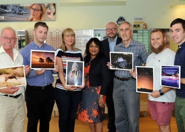 Life Through a Lens finalists and winners pictured with Krishna Parma, centre, the director of Specsavers in Ilkeston and Ashley Booker, fourth right, from the Ilkeston Advertiser, after the presentation of prizes on Monday evening. They are from left, David Cook, Matt Crouch, Helen Bird, Krishna Parma, Ashley Booker, Nigel Downes, David Fairclough and Simon Robinson.