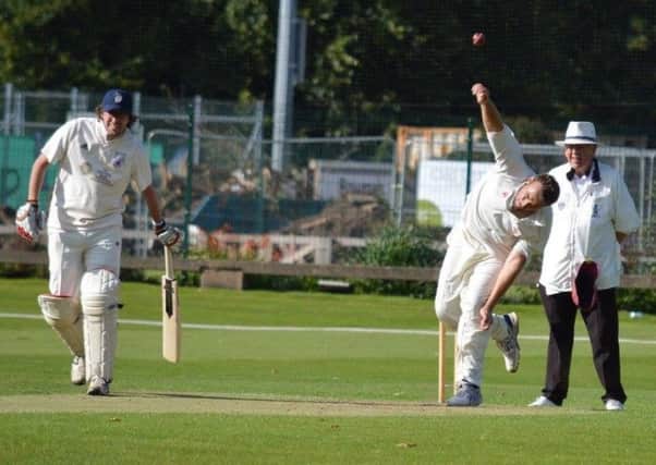 Jamie Horton on his way to a five-wicket haul in Holmewoods fine win over Belper Meadows. (PHOTO BY: Carl Jarvis)