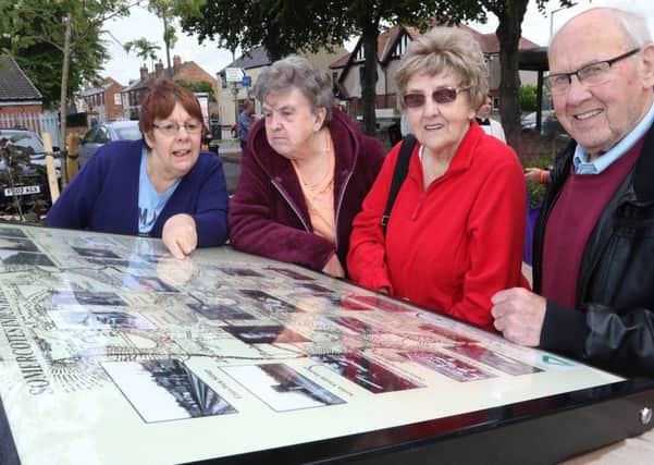 A new display on the town's industrial heritage is admired by Alex Daykin, Mabel Syson, Ellen Hughes and James Smithurst