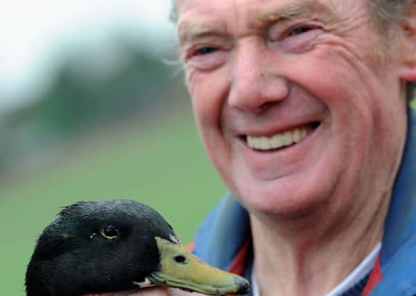 Cliff Mullins with 18 year old duck, Damon.