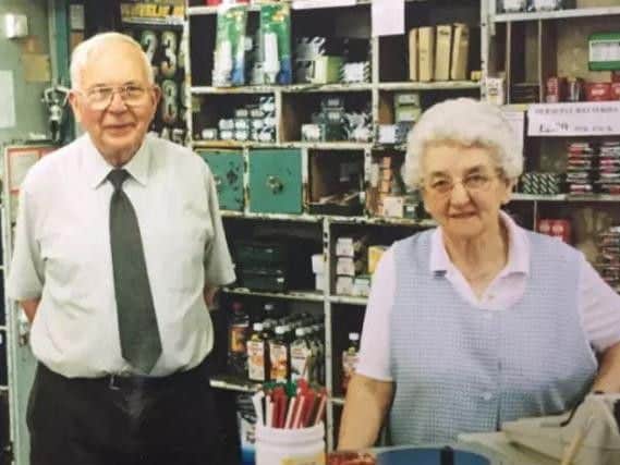 Mr Johnson and his wife, Myra, behind the counter of the well-known shop.