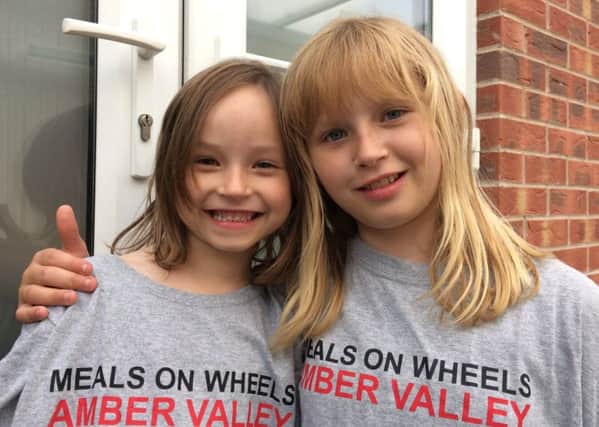 Jess, left, and Kiera France have spent their summer holidays spreading cheer and community spirit to the homes of isolated people in Amber Valley.