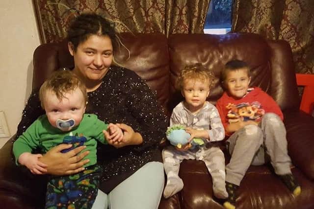 Graham's wife Davida with six-year-old Zack, two-year-old Leon and one-year-old Denzil.