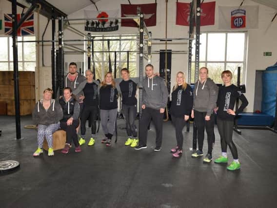 Crossfit 252 owners Paul and Sarah Roberts pictured with members. Picture by Rachel Atkins.