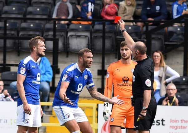 Picture Andrew Roe/AHPIX LTD, Football, EFL Sky Bet League One, Notts County v Chesterfield Town, Meadow Lane, 12/18/17, K.O 3pm

Chesterfield's Scott Wiseman (l) is sent off by referee Andy Haines
Andrew Roe>>>>>>>07826527594