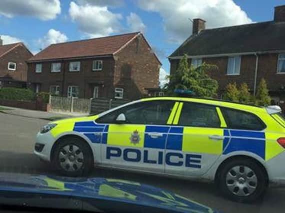 Police car at the scene of the incident on Sycamore Avenue, Glapwell