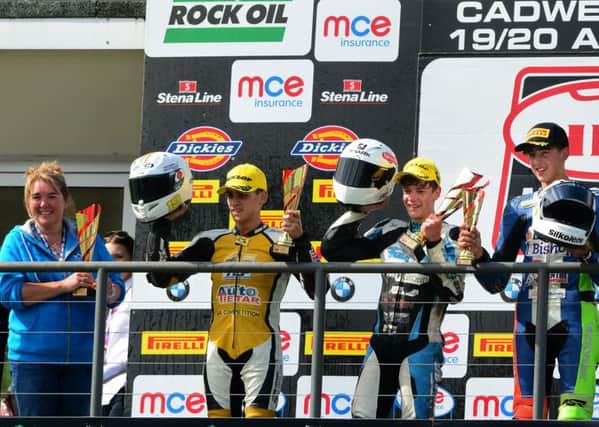 Max Cook (centre) on the podium after his victory as Nikita Cartwright (left), who is Gary Wilson's partner, collects the team award on behalf of Wilson Racing. (PHOTO BY: Hairy Beast Pix).