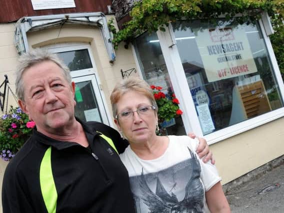 David and Tracey Suffell outside their newsagents, which is closing for good soon. Picture by Anne Shelley.