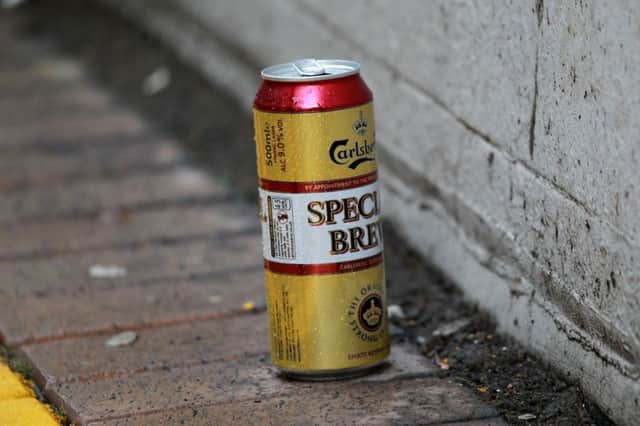 STOCK: street drinking beer can on the street.